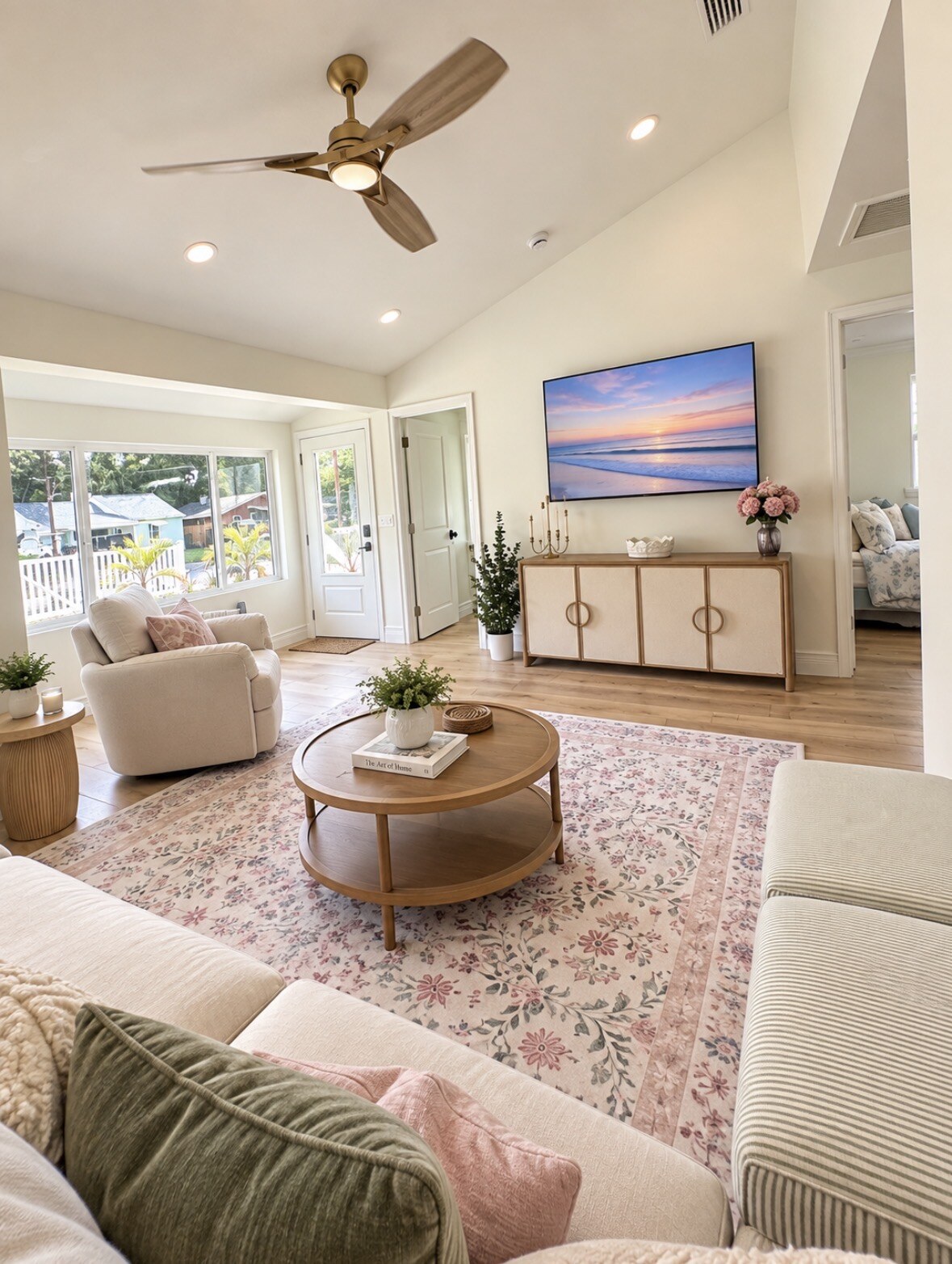 Living room facing the television and front entry
